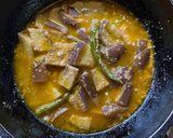 A picture of step 3 of Begun Jhaal Posto / Eggplant with Poppy seed paste for lunch in Thakurbari style.