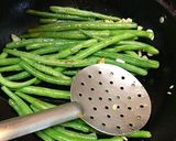 A picture of step 6 of Buttery Sautéed French Beans with sesame seeds.
