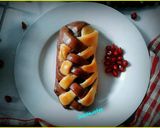 A picture of step 18 of Banana and chocolate filled  double colored braided bread.