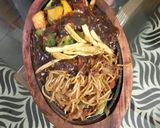 A picture of step 10 of Veg sizzler of sehezwan hakka noodles with sauteed vegetable.