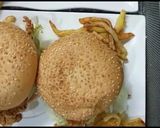 A picture of step 7 of Crisp fry chicken burgers 👌😋.