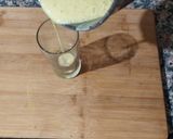 A picture of step 6 of Virgin Yakult Pina Colada topped with Whipped Cream.