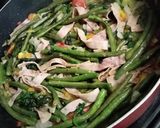 A picture of step 3 of Fried Green Beans with Ham & Radish Greens.