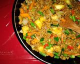 A picture of step 5 of Pineapple Thai fried rice.