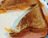 A picture of step 4 of Grilled Ham and Cheese on White Bread.