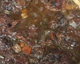 A picture of step 5 of Braised oxtail in a red wine reduction .