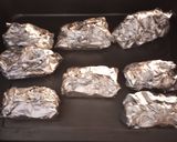 A picture of step 1 of Steam Baked Corn.
