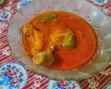 A picture of step 10 of Achari chicken.