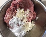 A picture of step 1 of Meat dumpling pho with great aroma of lemongrass.