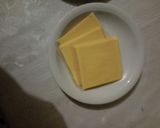 A picture of step 3 of Onion & Cheese toasted sandwich.