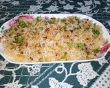 A picture of step 9 of Red Chilli Capsicum Rice.