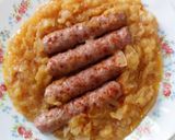 A picture of step 1 of Sausages In Apple & Onion Sauce.