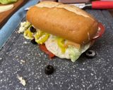 A picture of step 5 of Subway at home/ sub board.