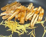 A picture of step 10 of Stir-Fried Tofu Skin with Oyster Sauce and Two Mushrooms.