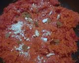 A picture of step 3 of Gajar Ka Halwa with milk and cashews.