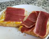 A picture of step 1 of My breakfast today 😋 🍞🧀🥓.