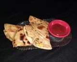 A picture of step 11 of Mexican cheesy vegetable quesadilla.