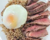 A picture of step 6 of Garlic fried rice with sliced grilled beef sirloin.