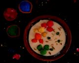 A picture of step 4 of Rabdi with colourful coconut ladoo.
