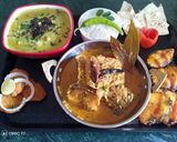 A picture of step 11 of Masala fish curry.