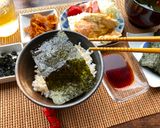 A picture of step 5 of Japanese Breakfast (how to eat Nori seaweed and rice).