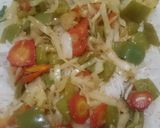 A picture of step 16 of Spicy BBQ chicken ricewith stir fry vegetables.