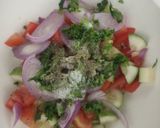 A picture of step 1 of Italian rustic cucumber and tomato salad.