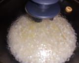 Foto del paso 4 de la receta: Arroz blanco salteado en mantequilla al ajillo