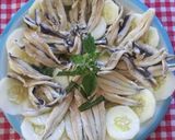 Foto del passaggio 1 della ricetta Alici marinate su letto di cetriolo