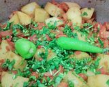 A picture of step 3 of Aloo matar gajar mix veggies.