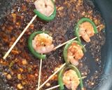 A picture of step 6 of Orange glazed prawn stick.