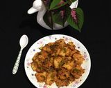 A picture of step 8 of Chatpata Bread Upma in red sauce.