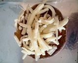 A picture of step 4 of Easy Mini English Muffin Pizzas.