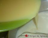 A picture of step 9 of Karidopita with pudding and chocolate glaze.