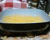 A picture of step 14 of Chicken Parmesan With Spaghetti and Garlic Bread.