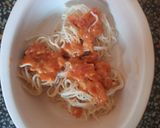 A picture of step 10 of Cheesy Noodles with Dumplings.