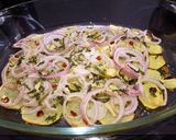 A picture of step 4 of Dover Sole in the oven with hot and crispy onion and potato on the side.