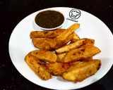 A picture of step 11 of Crispy potato wedges with mint tomato chutni.