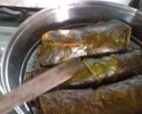 A picture of step 4 of Homemade crispy Patra with some spicy green chutney.