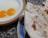 A picture of step 1 of Anday wali tawa cooked roti.