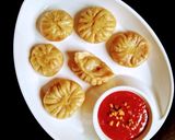 A picture of step 6 of Veg Momos (with beetroot stuffing).