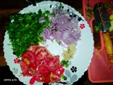Fried nduma with beef and potato served. with spinach