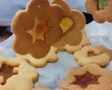 A picture of step 7 of Edible Christmas tree décor; stained glass windows biscuits.