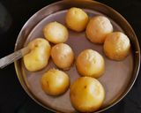 A picture of step 1 of Kashmiri Dum Aloo.