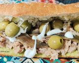 A picture of step 4 of Tuna and Anchovy Sandwich with Guacamole and Olives.