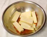 A picture of step 2 of Paneer wrapped in banana leaf.