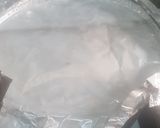 A picture of step 12 of Coconut party jollof rice.