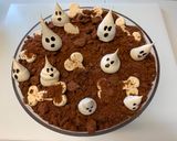 A picture of step 10 of Graveyard Trifle with Meringue Ghost Cookies.