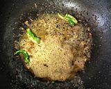A picture of step 1 of Chingri Narkel diye Laal Shaag / Shaak.
