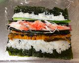 A picture of step 8 of Mickey Mouse Roll Sushi.
